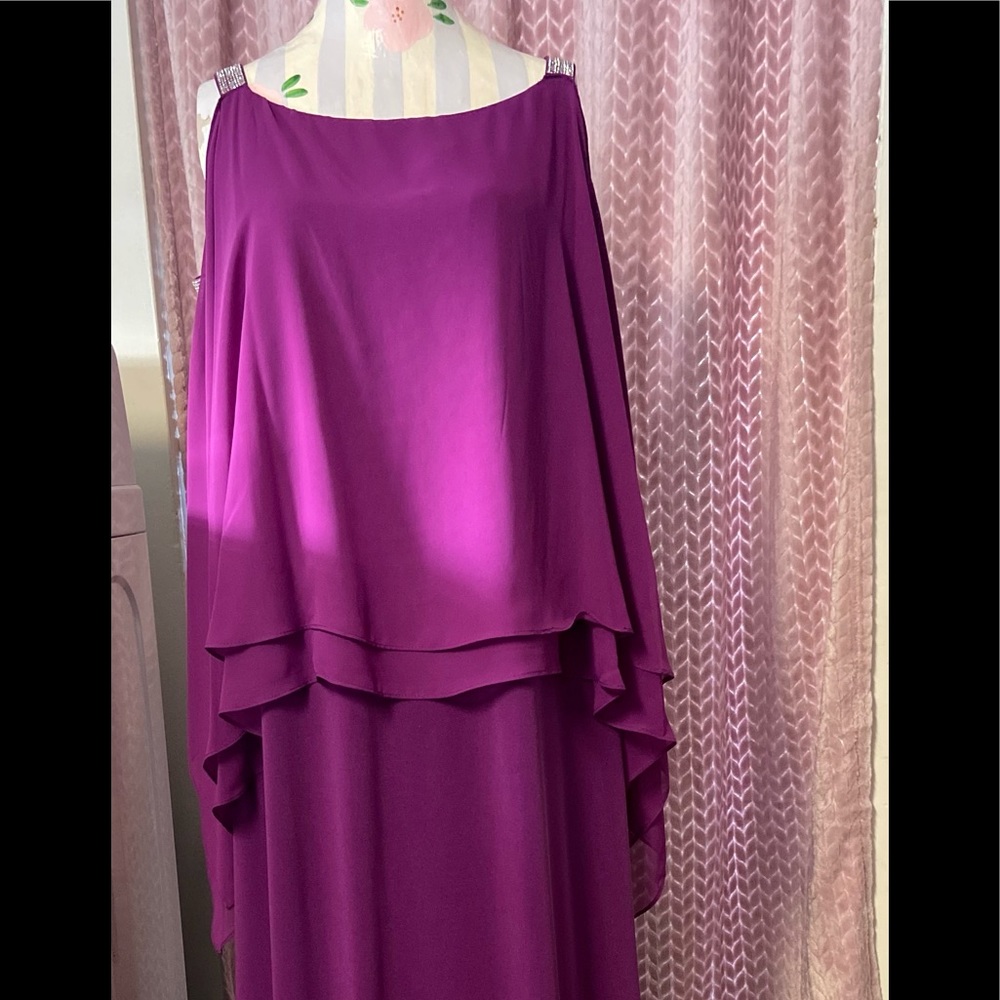 Floor length Amethyst gown. Open sleeves and slit bottom.